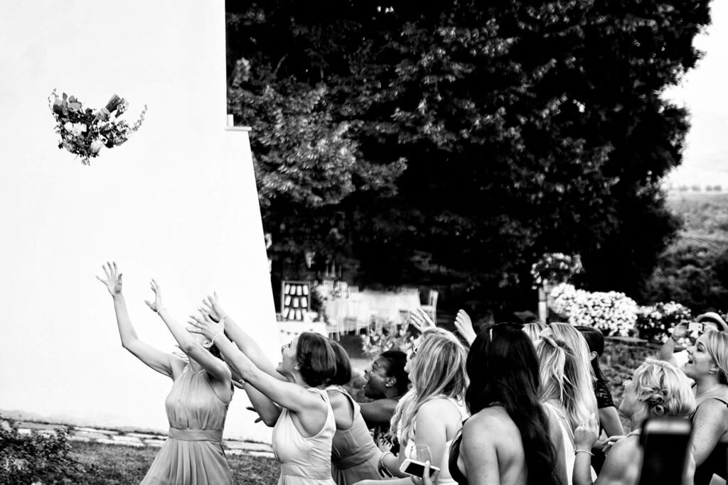 Bride throws her bouquet wedding in Tuscany