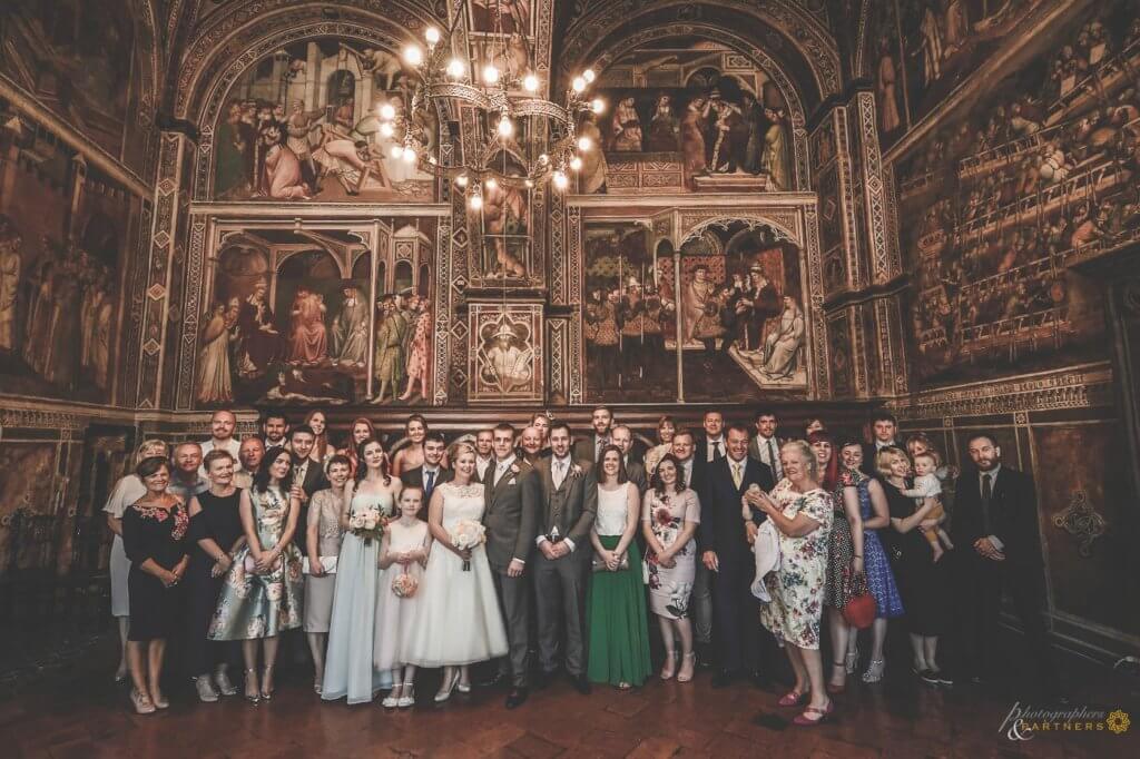 Bride and groom make a photo with guests