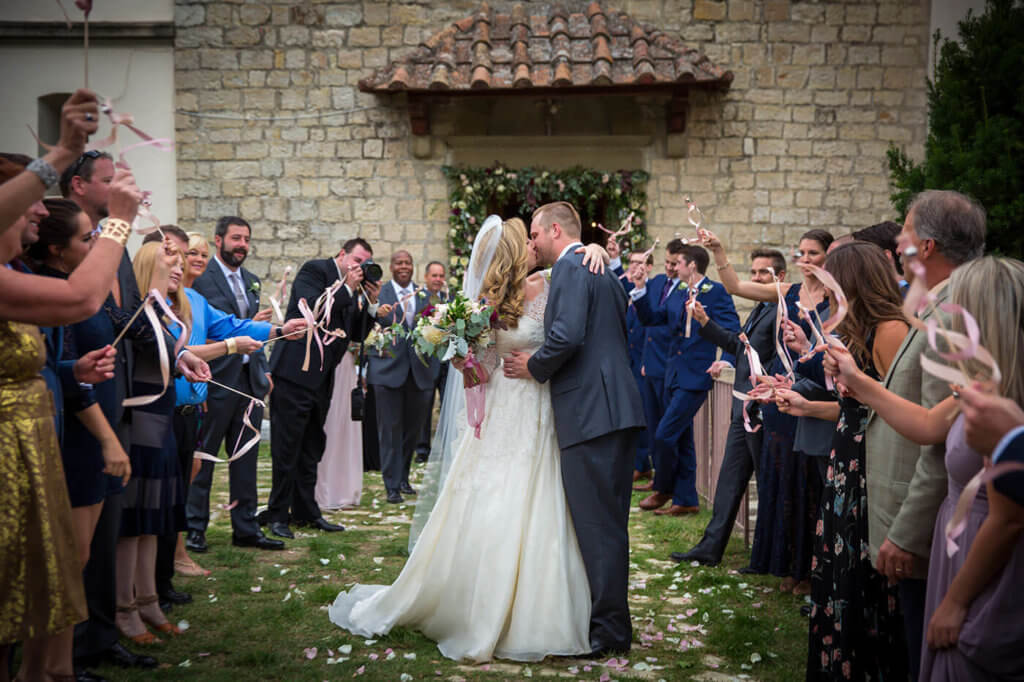 Husband kiss his wife out of the church