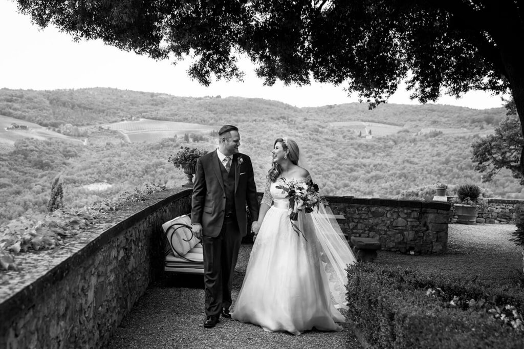 Whitney & Micheal walk in the garden of the Castle