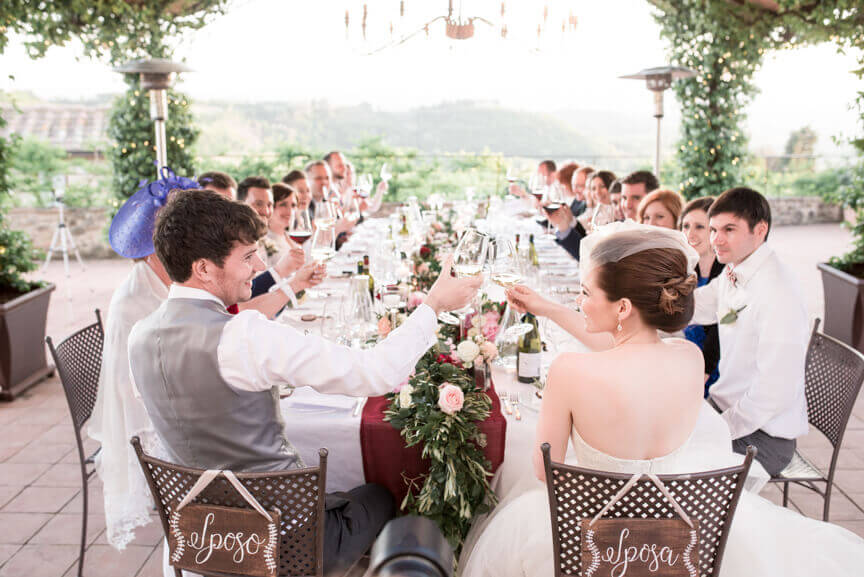 The groom and the bride enjoy the reception with their guests