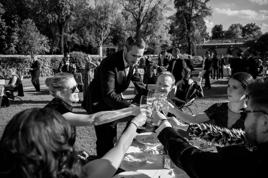 The groom have a toast with the guest after the wedding