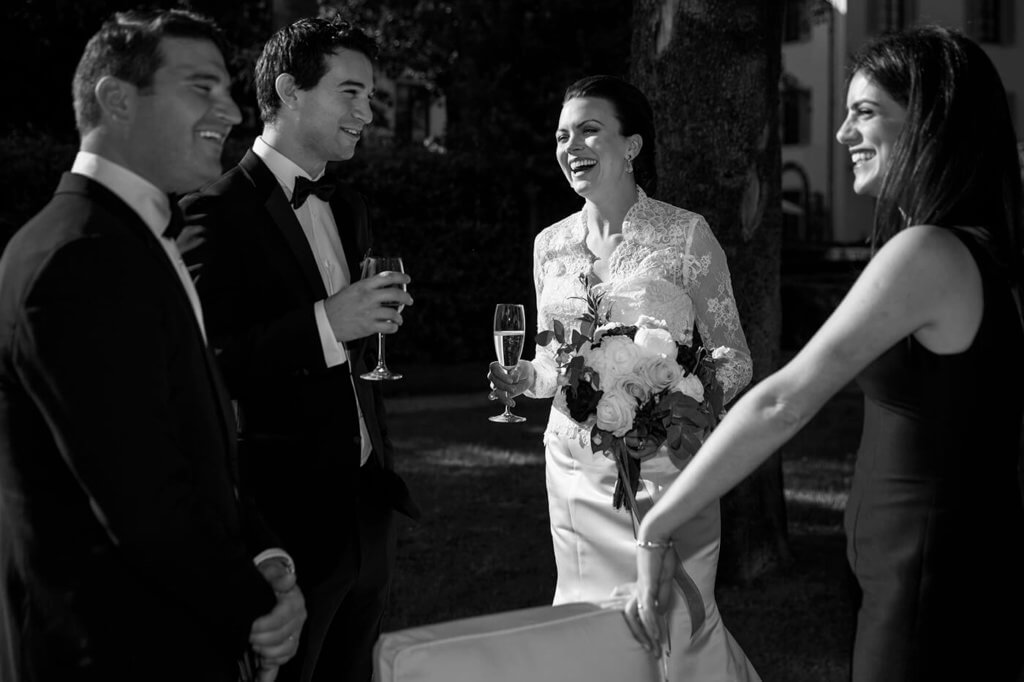 The bride have a toast with the guest after the wedding