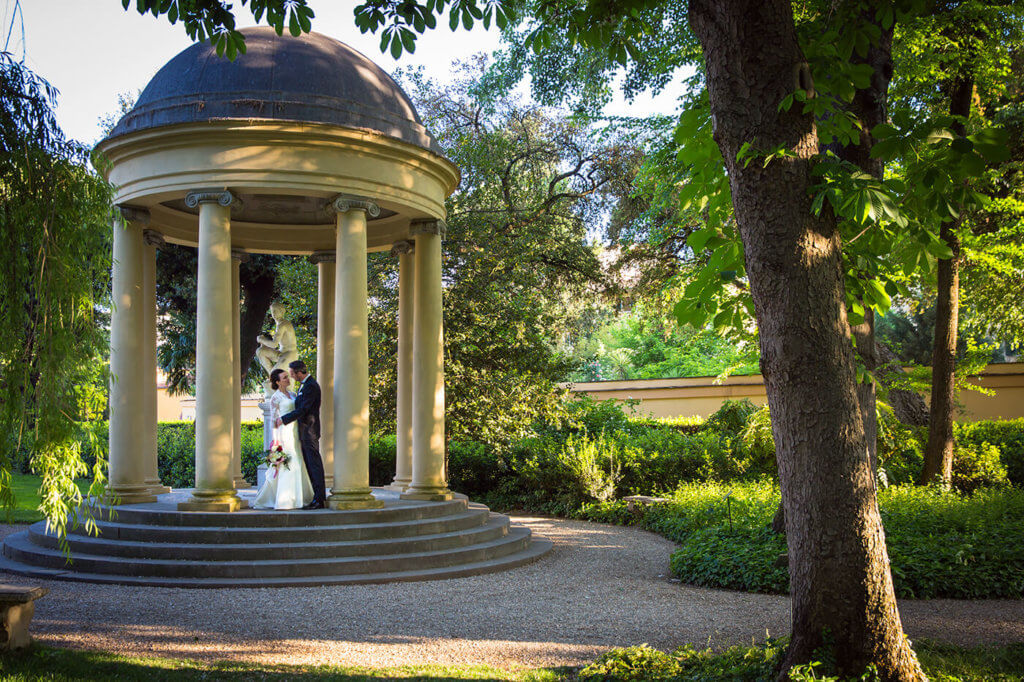 Bride and groom explore the hotel garden