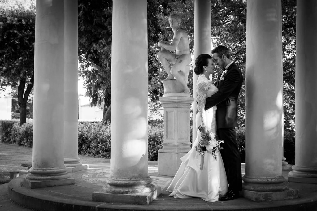 The groom and the bride exchange a romantic kiss