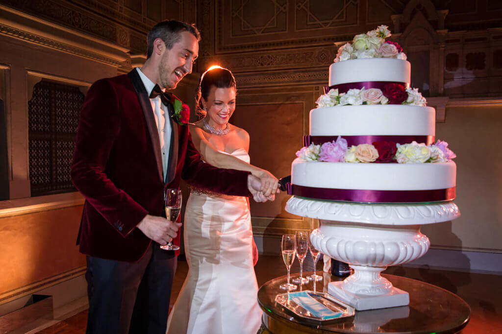 Bride and groom cut their wedding cake