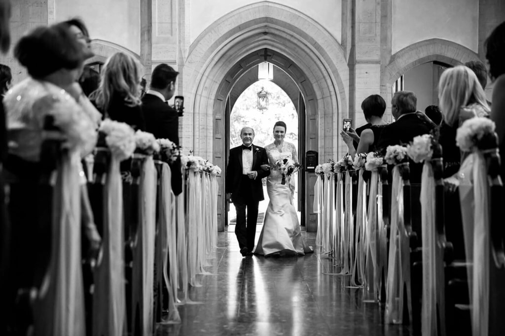 The bride arrives to the location of the ceremony with her father