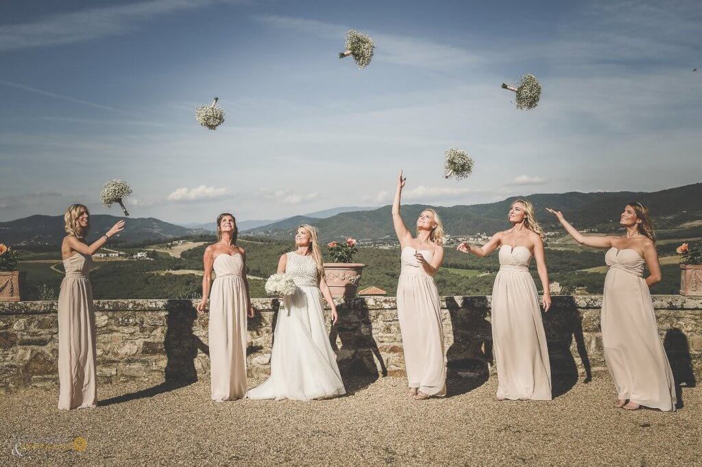 Emma and and bridesmaids throw the bridal bouquet.