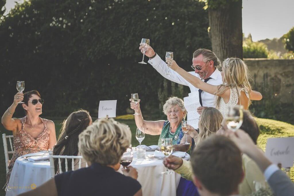 The bride's father reads a speech for the guests