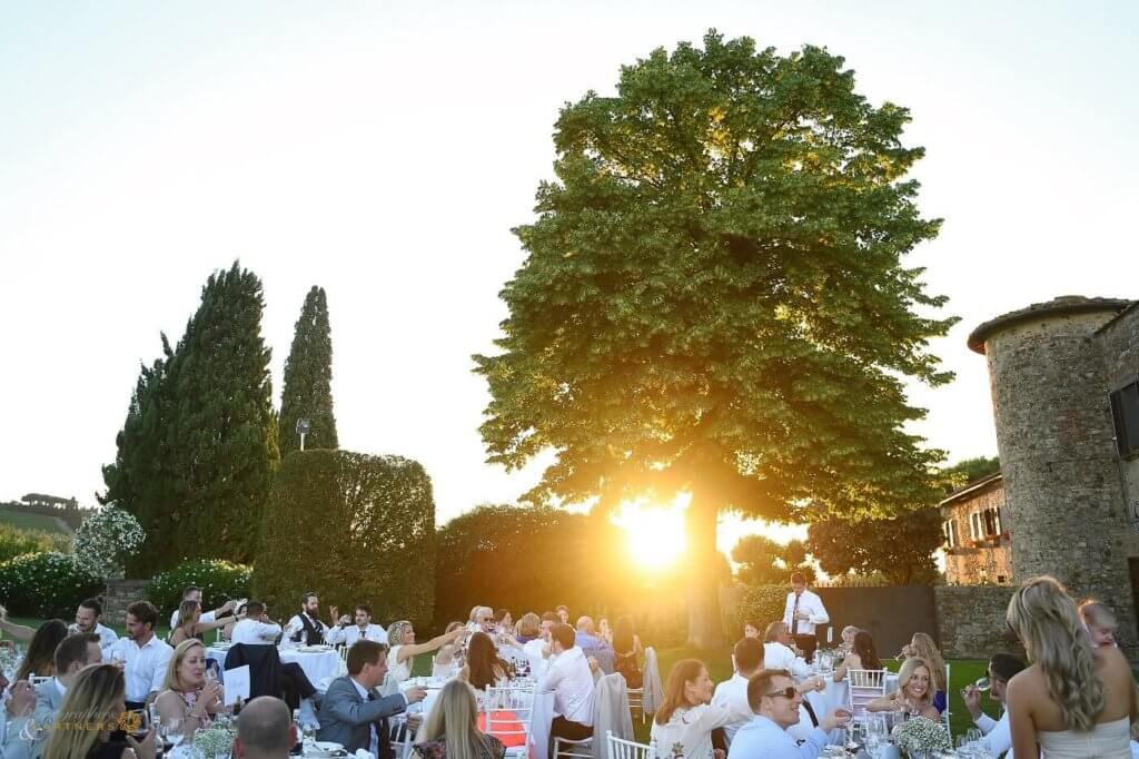 The newlyweds and their guests enjoy al fresco dinner