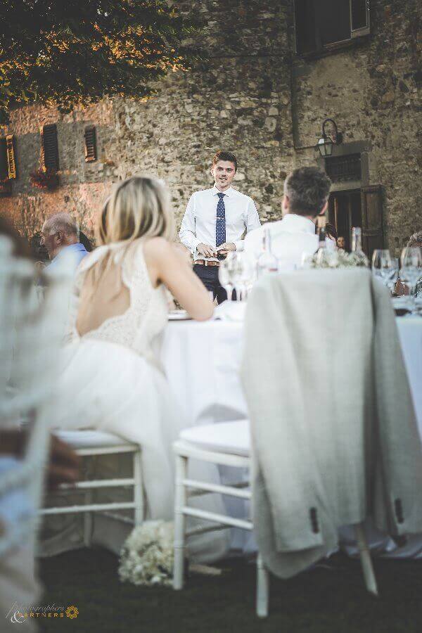 The groom reads a speech for the bride and the guests