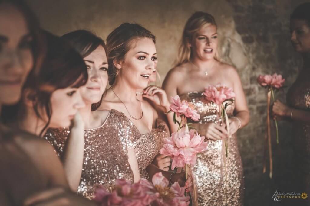 Bridesmaids get excited when they see the bride