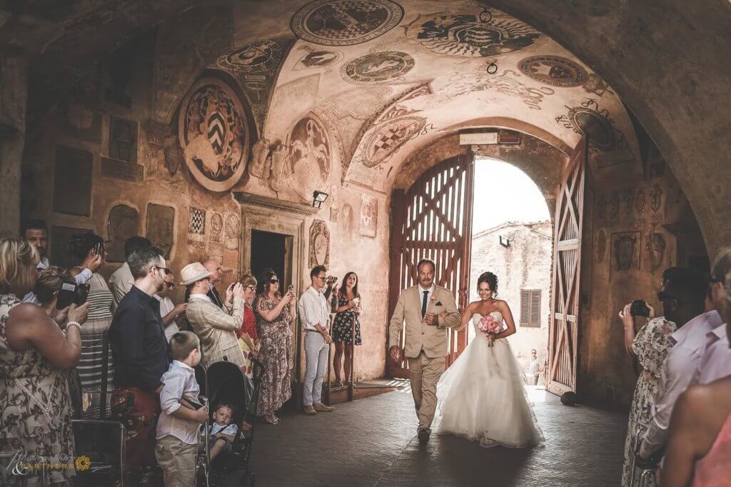 The bride arrives to the location of the ceremony with her father