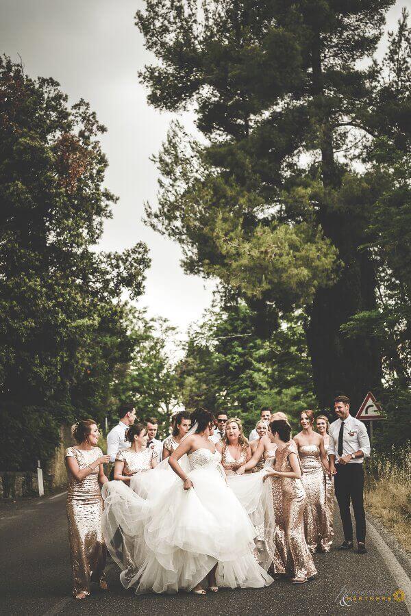 Bride walk with bridesmaids and groomsmen after the ceremony