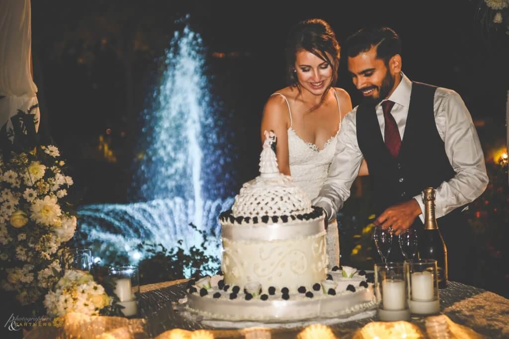 Bride and groom cut their wedding cake