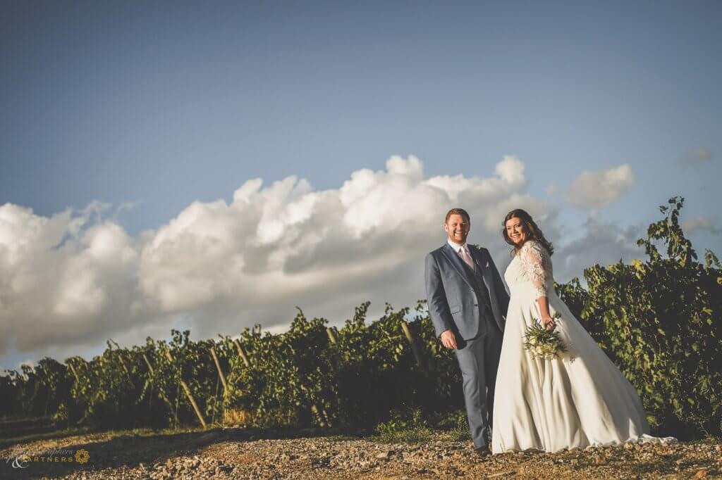 Emma & Edwar walk through the vineyard