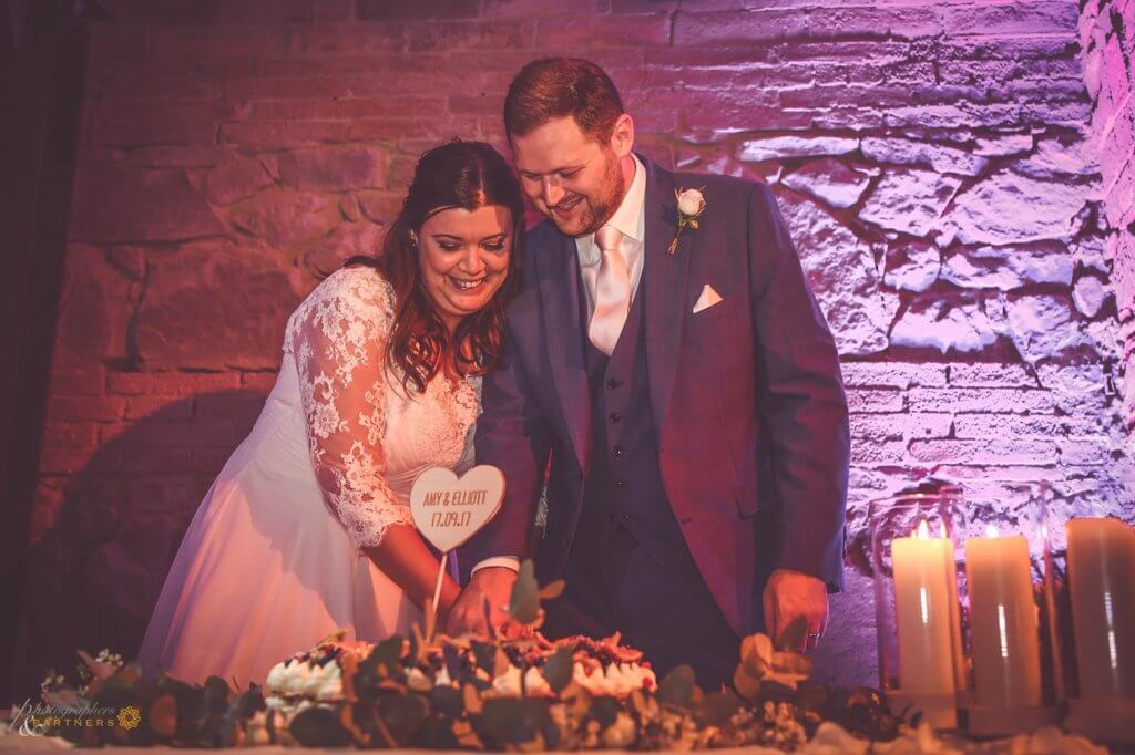 Bride and groom cut their wedding cake