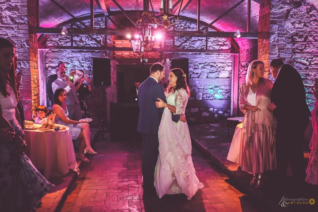 Amy & Elliot have a romantic first dance in the historical wine cellar