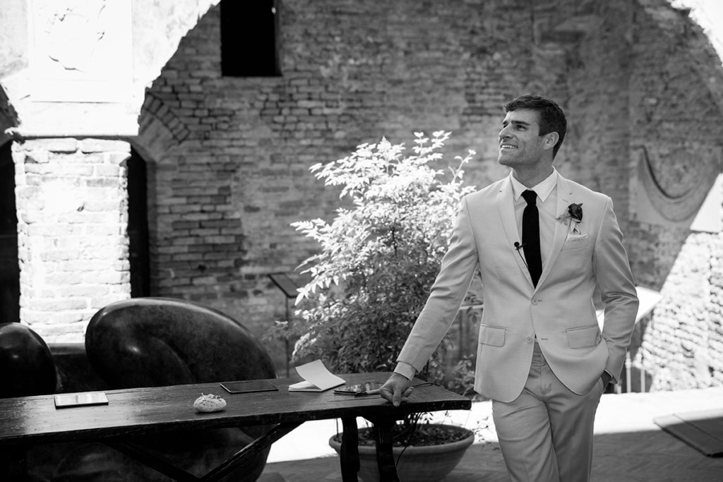 The groom waits for the bride at the altar