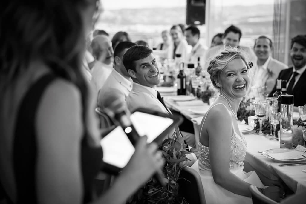 The bride's sister reads a speech for the guests