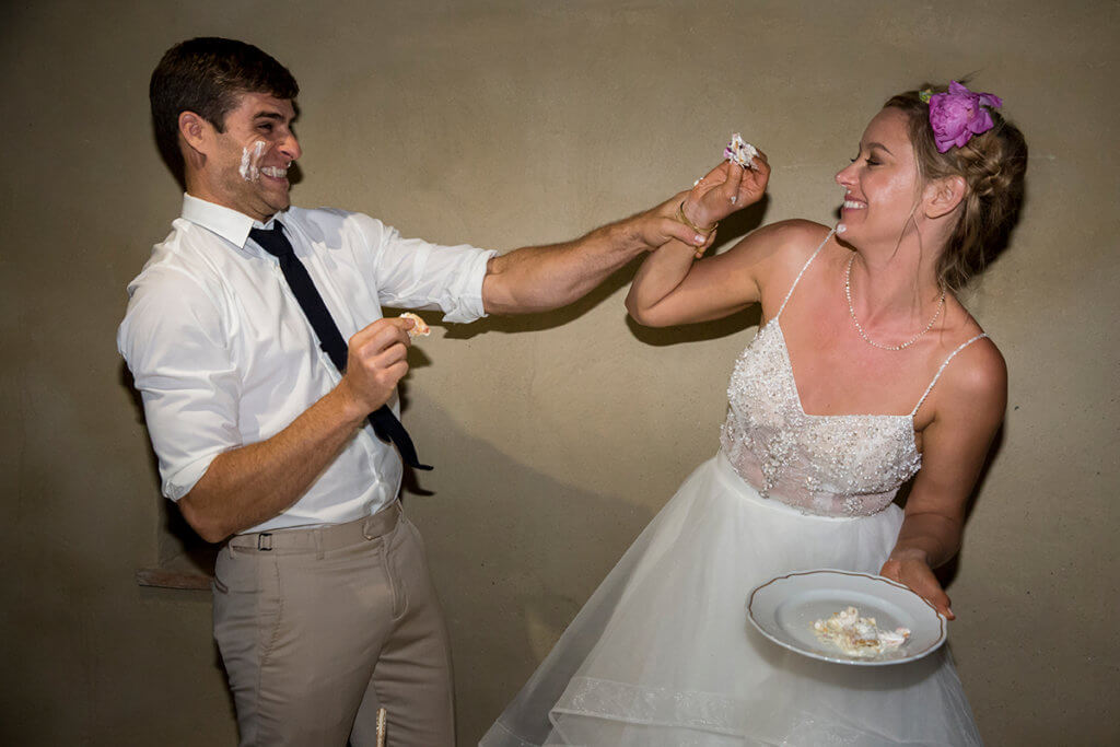 Lauren & Ben play with the cake