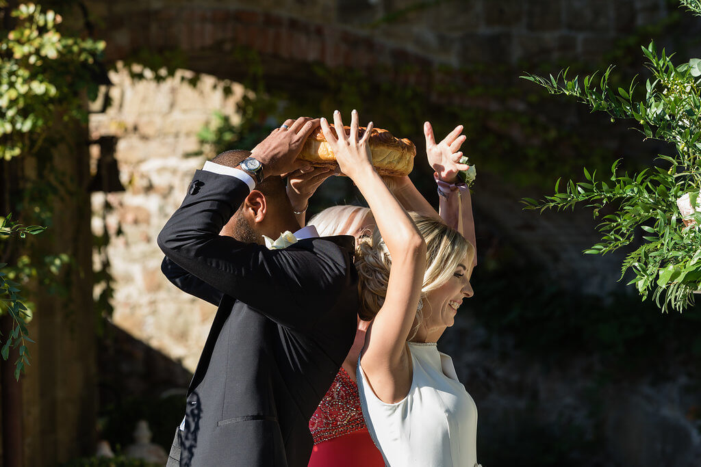 Groom and Bride break bread during the ceremony