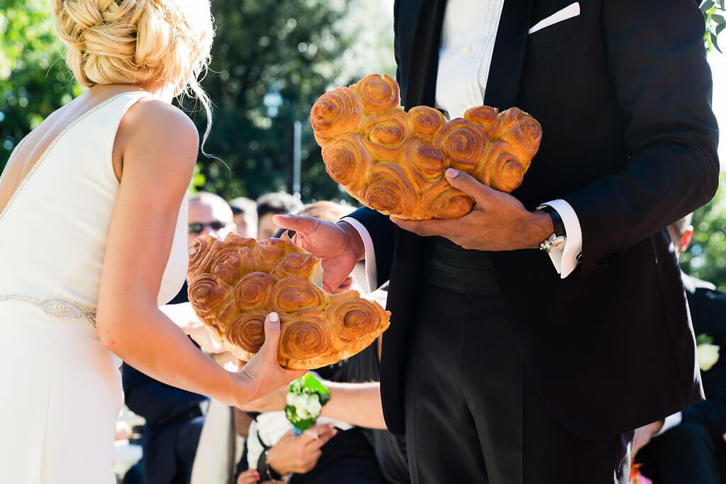 Bride and Groom break bread according to their tradition