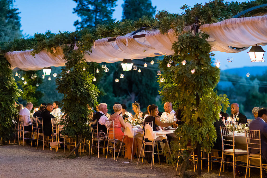 The newlyweds and their guests enjoy al fresco dinner