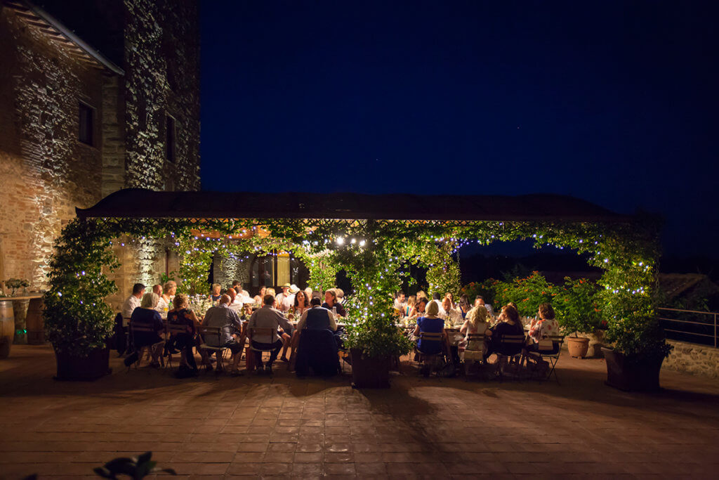 The newlyweds and their guests enjoy the wedding dinner