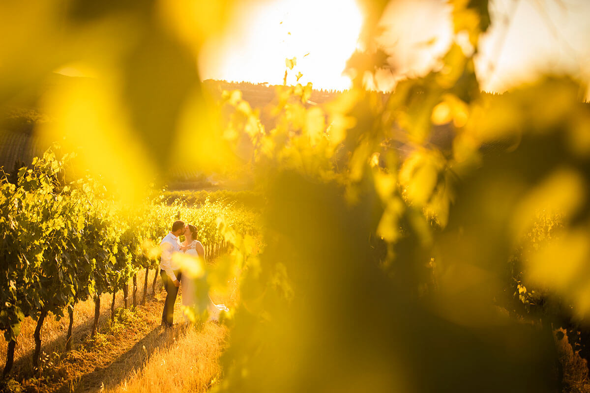 Anya & James kiss in the vineyard